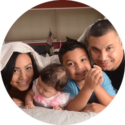 family sitting on a carpet