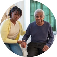 a young woman and older gentleman holding hands